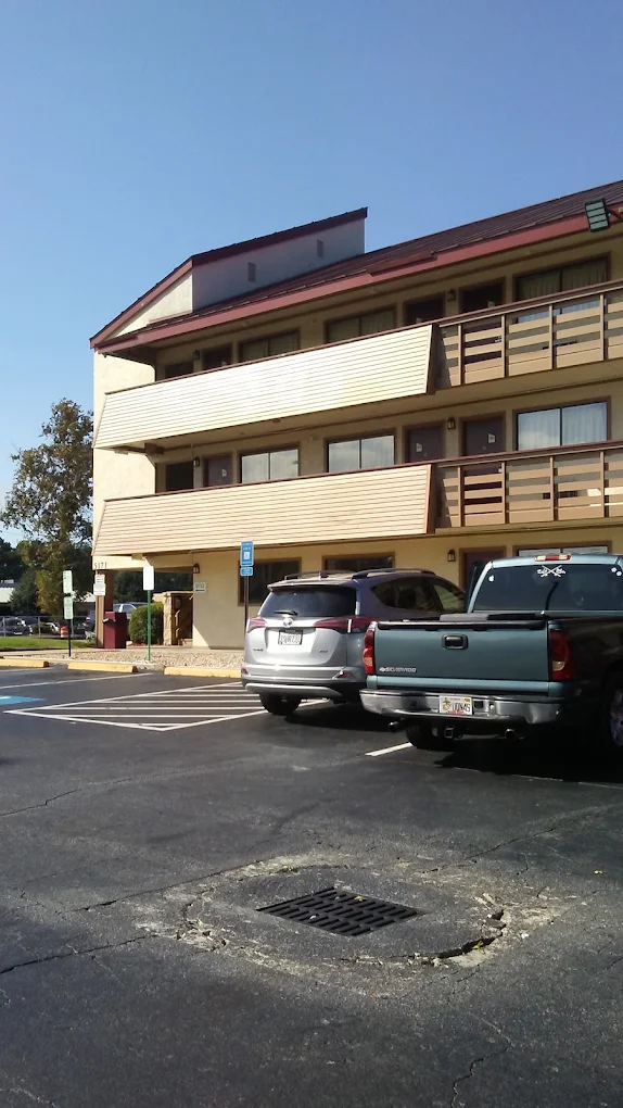 Free Parking Hotels in Norcross GA with Red Roof Inn Atlanta Norcross exterior and guest parking area